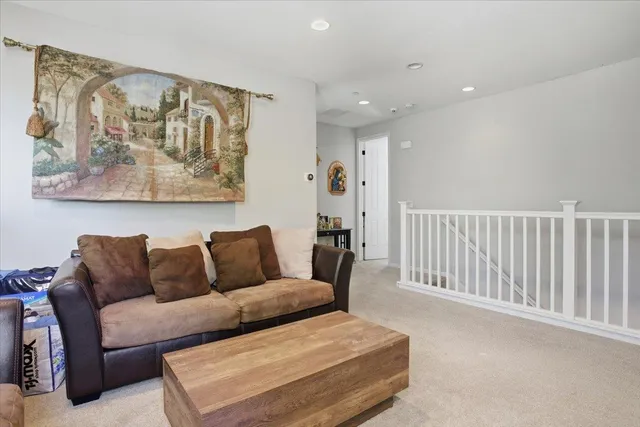 a living room with furniture and wall painting