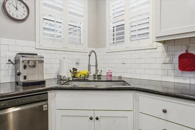 a kitchen with a sink and a stove