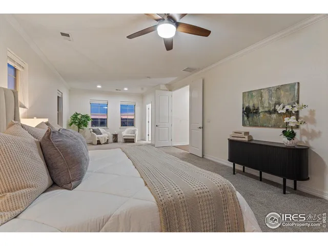 a spacious bathroom with a granite countertop sink a toilet a mirror and shower