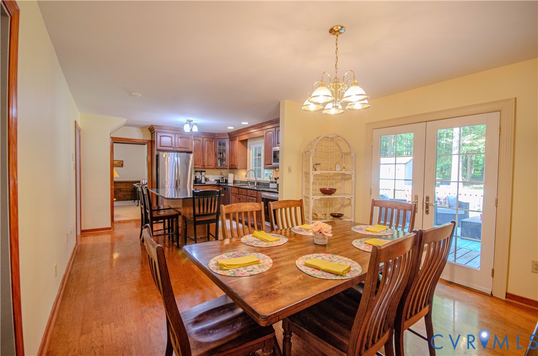 12500 Musical Lane Midlothian, VA 23113 - Photo 16 of 51 Dining area featuring wood-finish flooring and a b