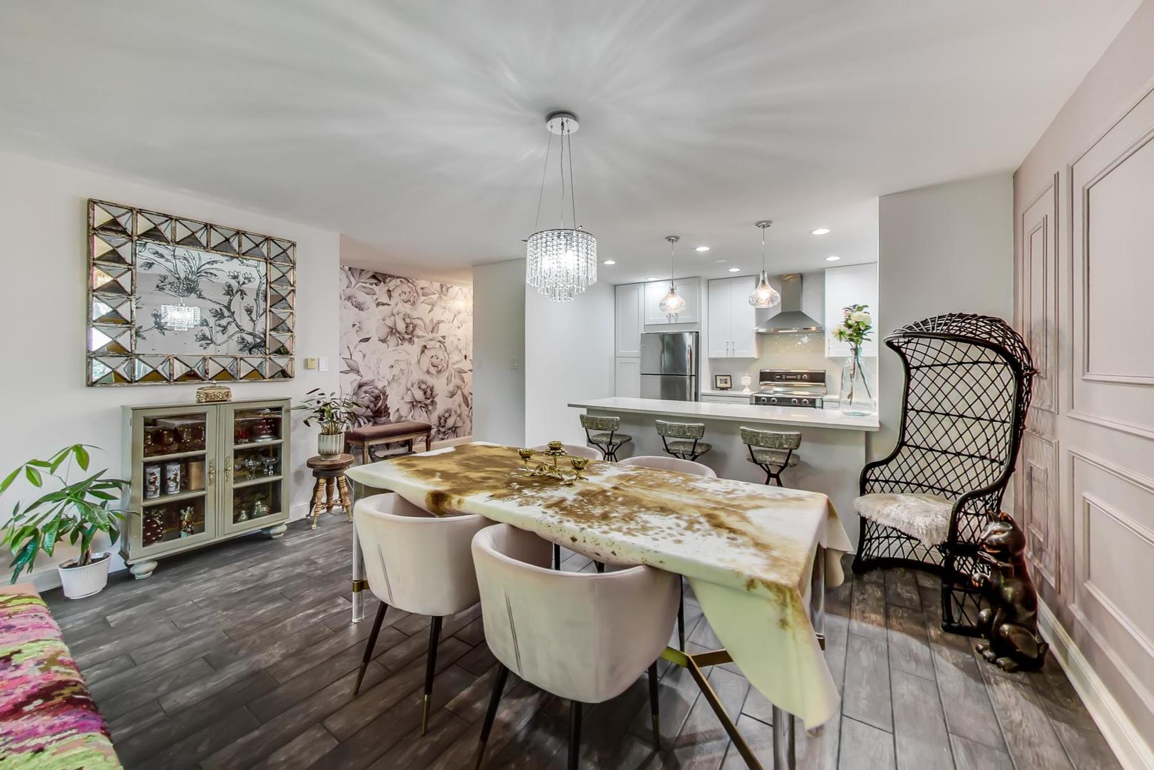 250 Ridge Avenue, Unit 3K Evanston, IL 60202 - Photo 11 of 24 a view of a dining room with furniture window and wooden floor