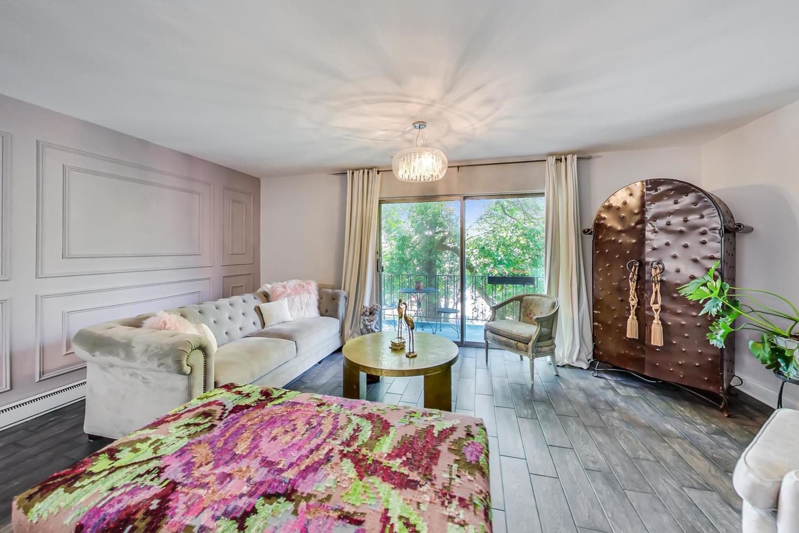 250 Ridge Avenue, Unit 3K Evanston, IL 60202 - Photo 12 of 24 a living room with furniture and a large window