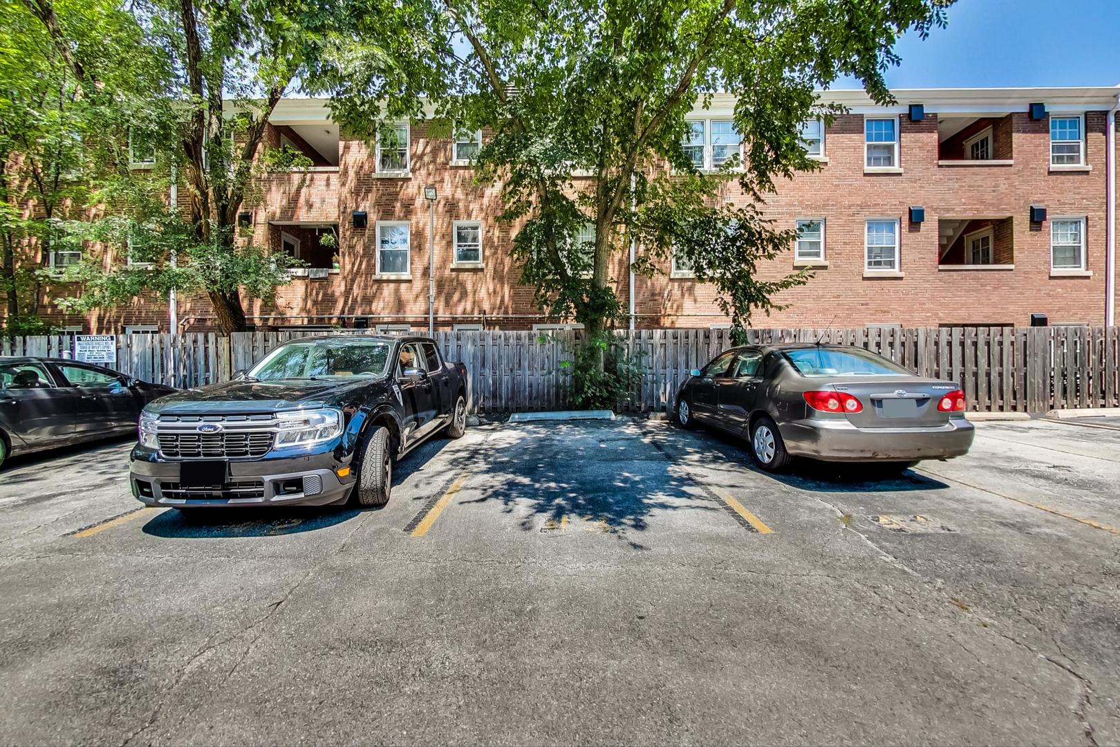 250 Ridge Avenue, Unit 3K Evanston, IL 60202 - Photo 24 of 24 a car parked in front of a brick house