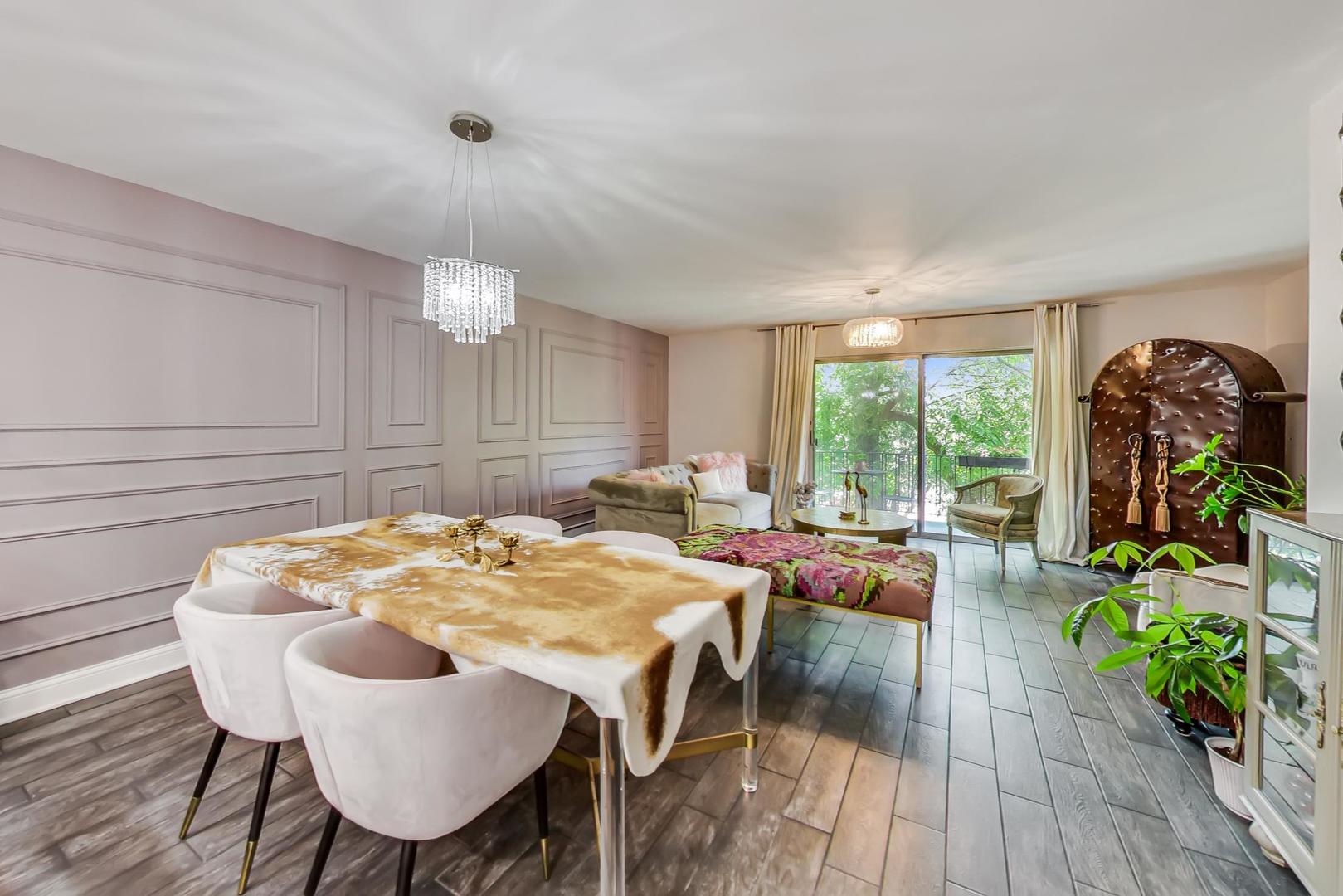 250 Ridge Avenue, Unit 3K Evanston, IL 60202 - Photo 10 of 24 a view of a dining room with furniture window and wooden floor