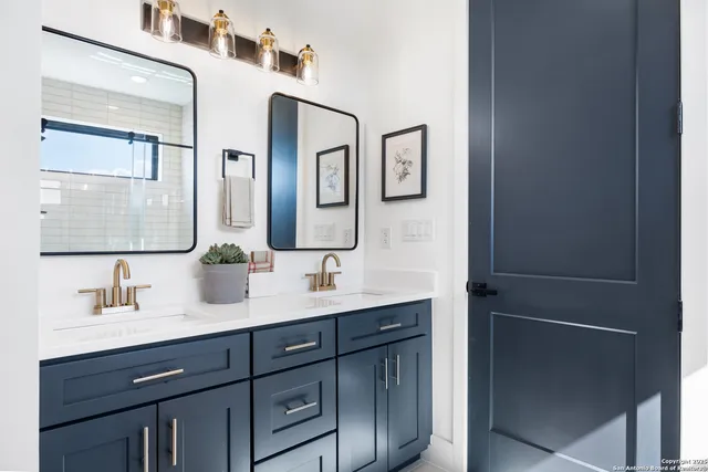 a bathroom with a sink and a mirror