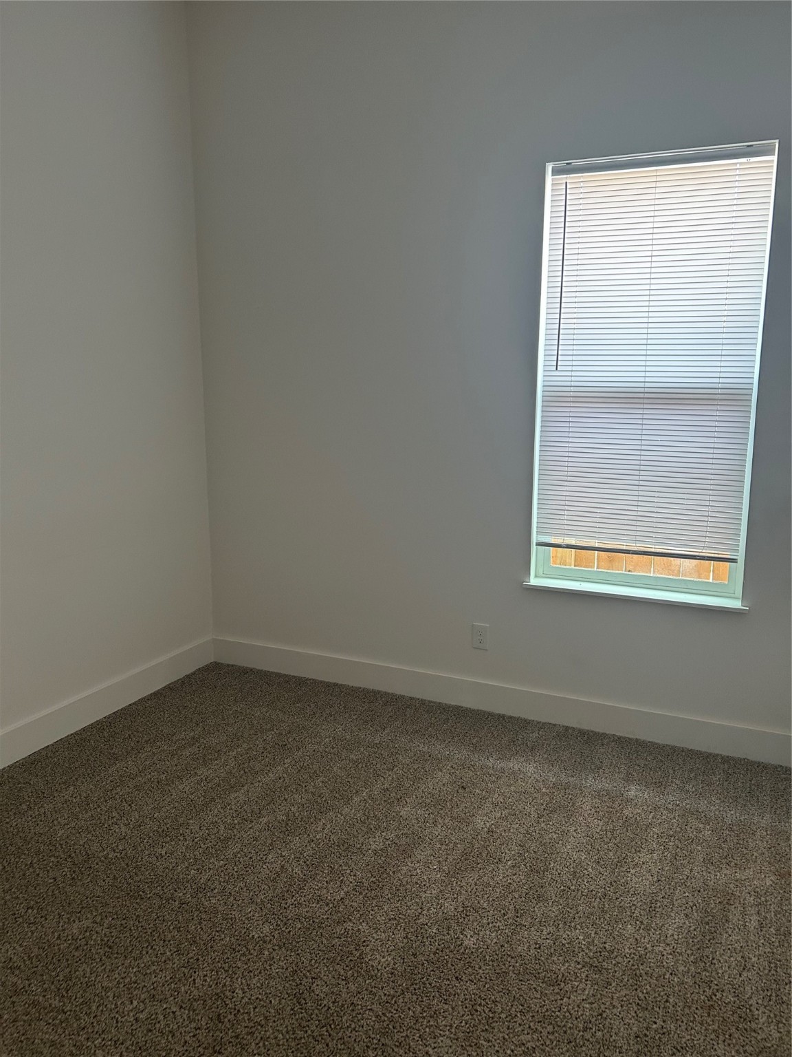 8203 Sparta Street, Unit B Houston, TX 77028 - Photo 5 of 12 an empty room with a window
