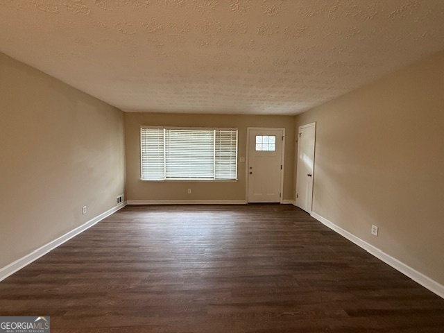 1068 Longshore Drive Decatur, GA 30032 - Photo 4 of 9 a view of an empty room with wooden floor and a window