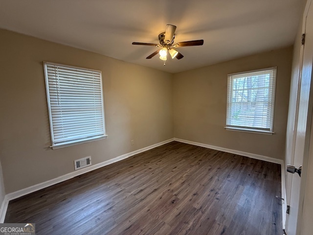 1068 Longshore Drive Decatur, GA 30032 - Photo 7 of 9 a view of an empty room with wooden floor and a window