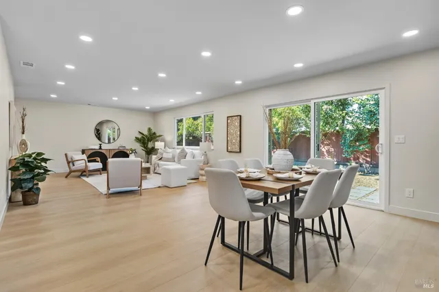 a view of a dining room with furniture window and outside view
