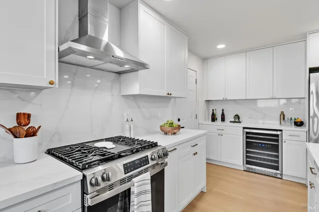 a kitchen with granite countertop a stove and a sink
