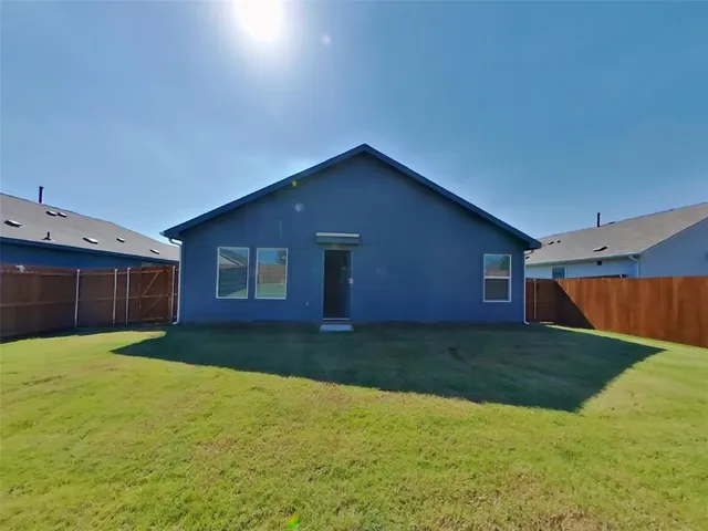 a view of a yard in front of a house