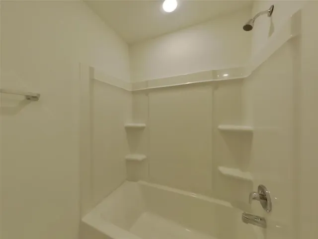 a close view of a bathtub in a bathroom