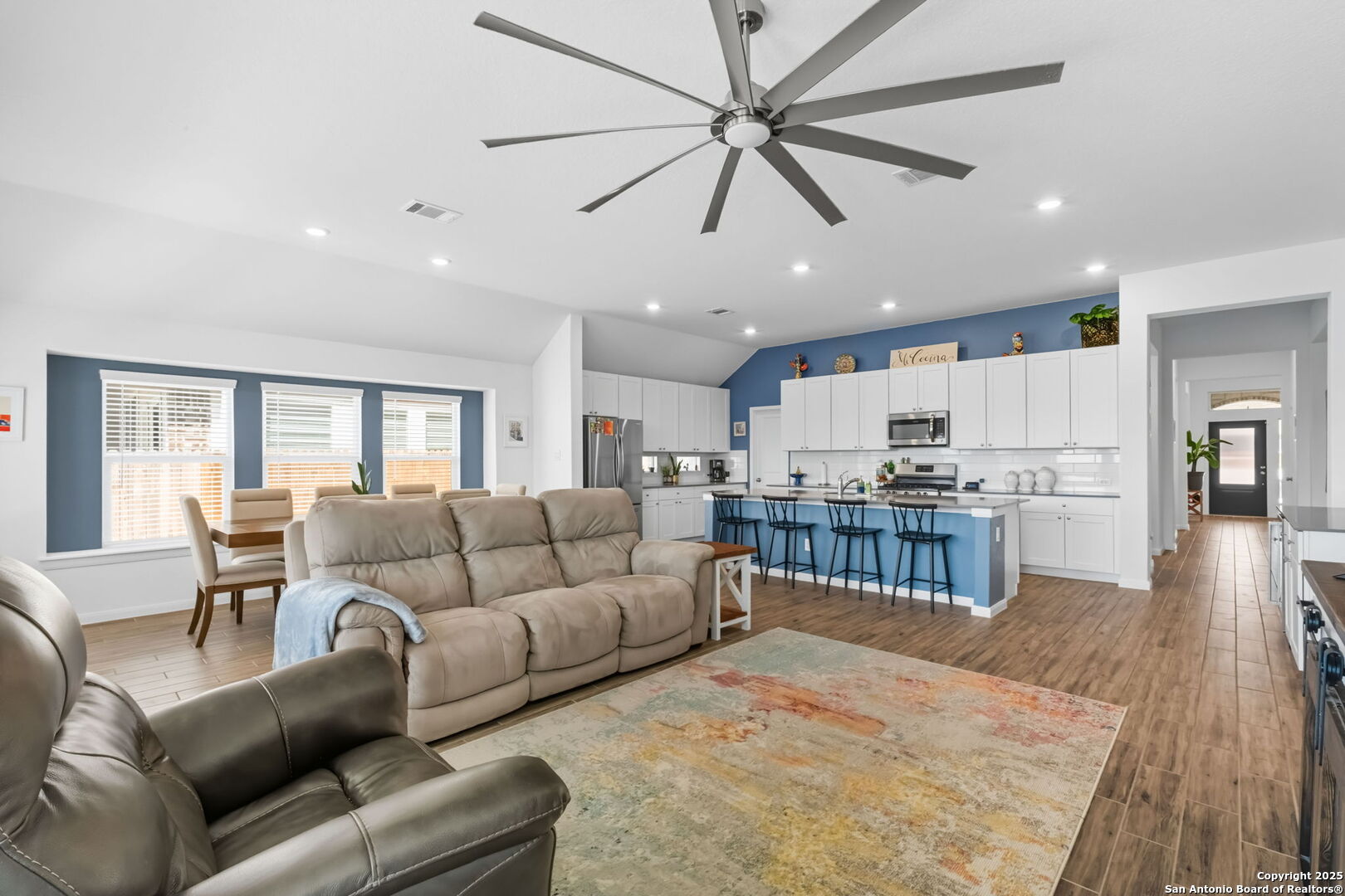 8950 Rancher Place Seguin, TX 78155 - Photo 11 of 34 a living room with furniture and kitchen view
