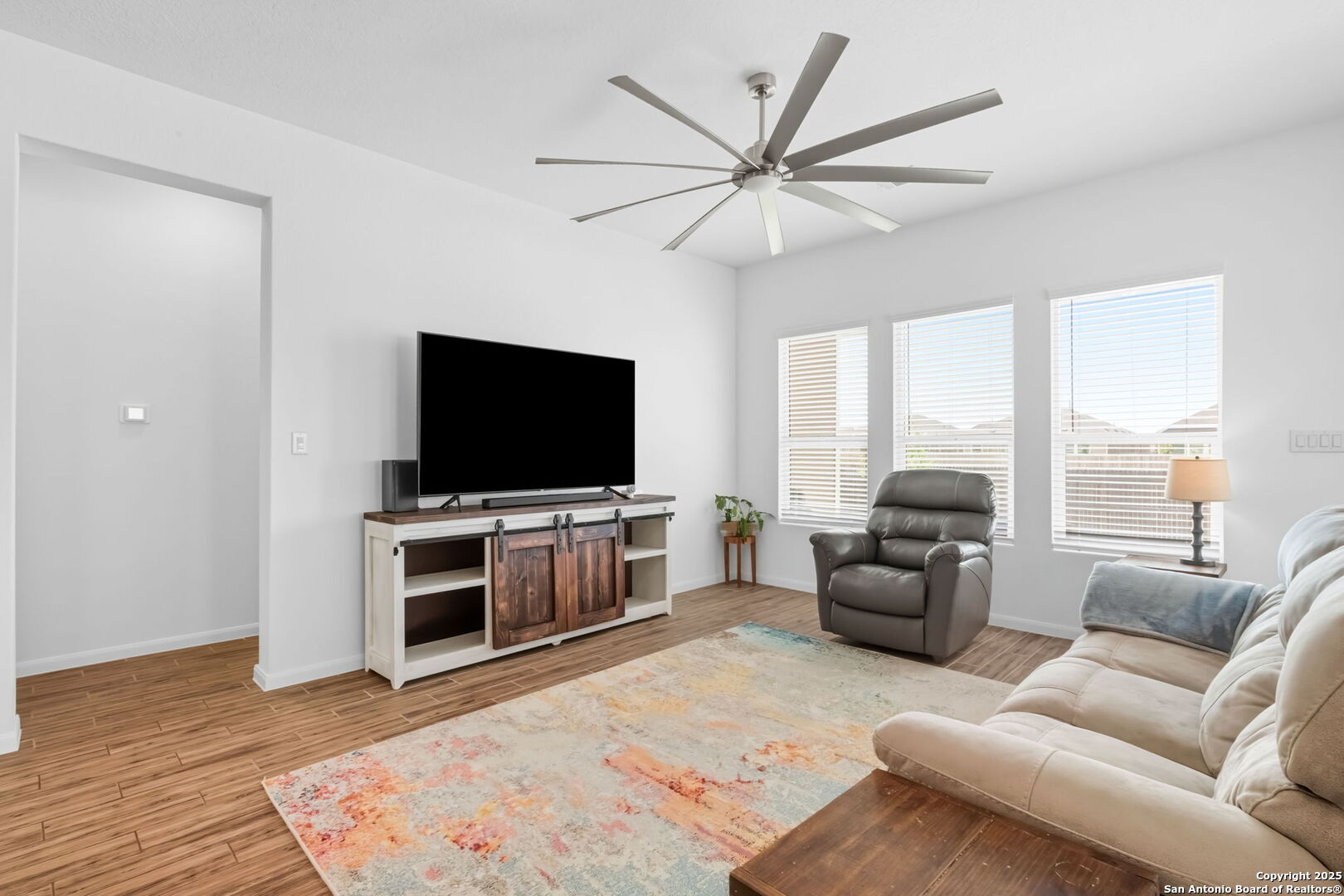 8950 Rancher Place Seguin, TX 78155 - Photo 12 of 34 a living room with furniture and a flat screen tv
