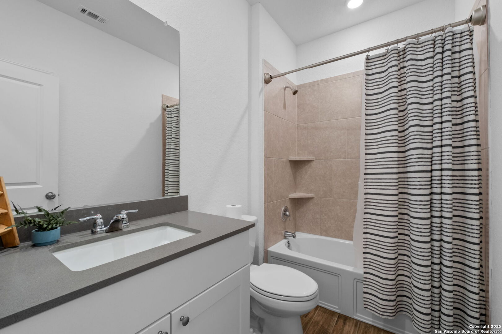 8950 Rancher Place Seguin, TX 78155 - Photo 24 of 34 a bathroom with a sink toilet and shower