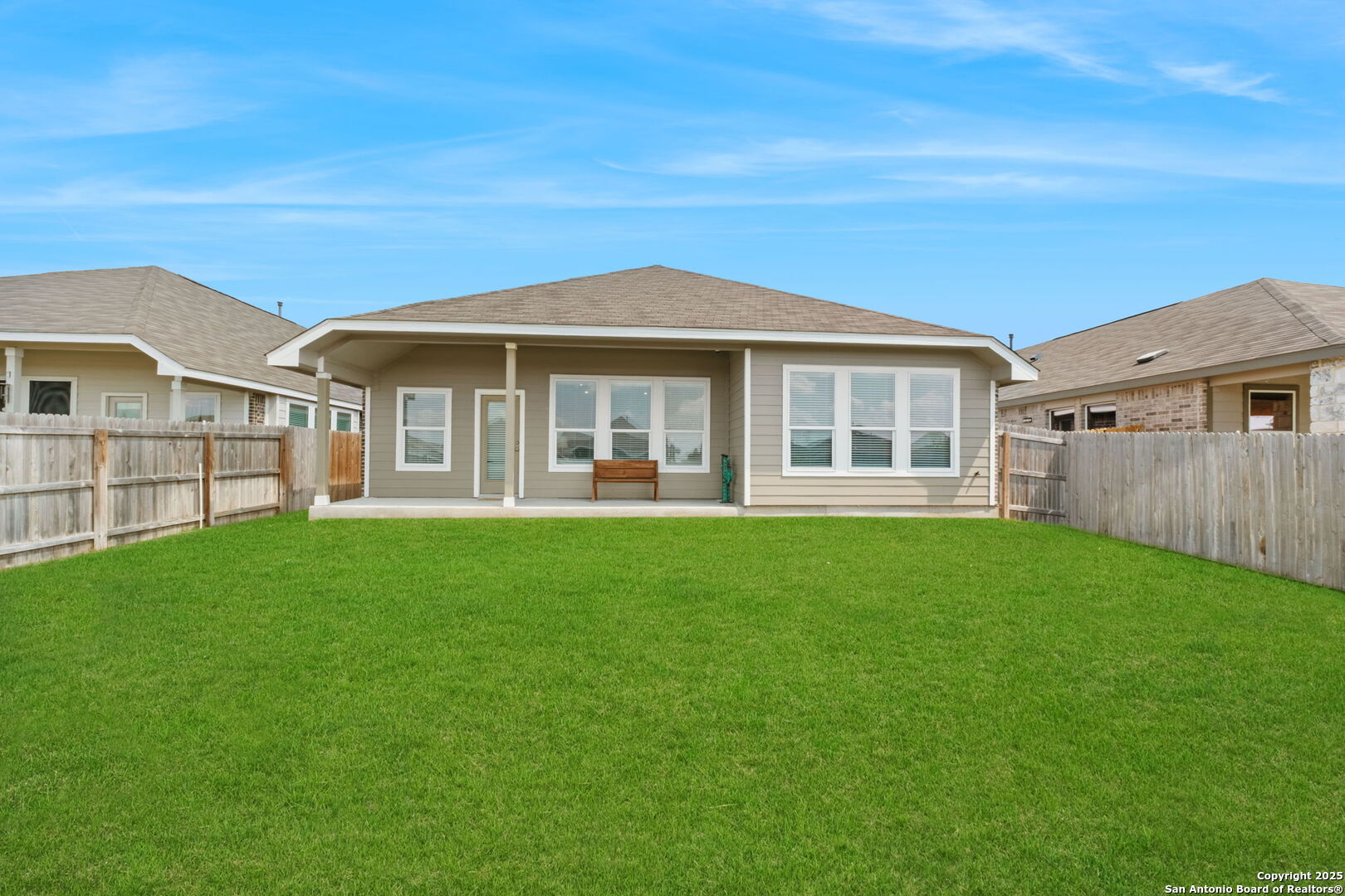8950 Rancher Place Seguin, TX 78155 - Photo 33 of 34 a front view of a house with a garden