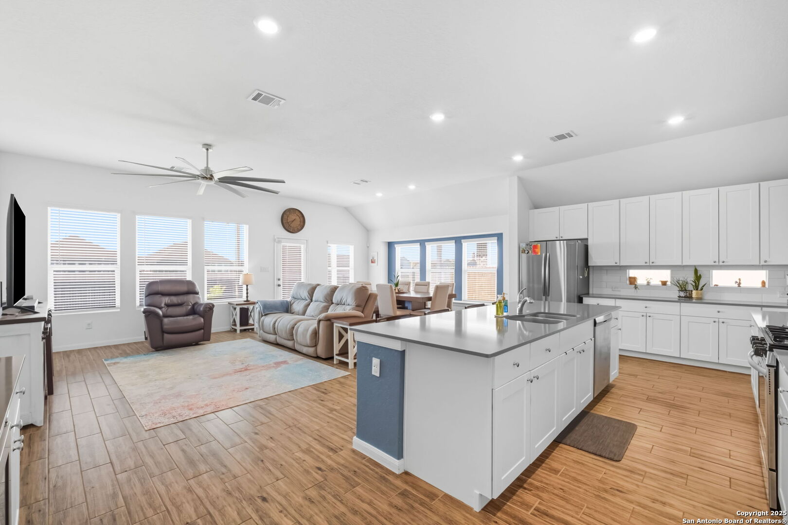 8950 Rancher Place Seguin, TX 78155 - Photo 8 of 34 a living room with kitchen island furniture and a large window