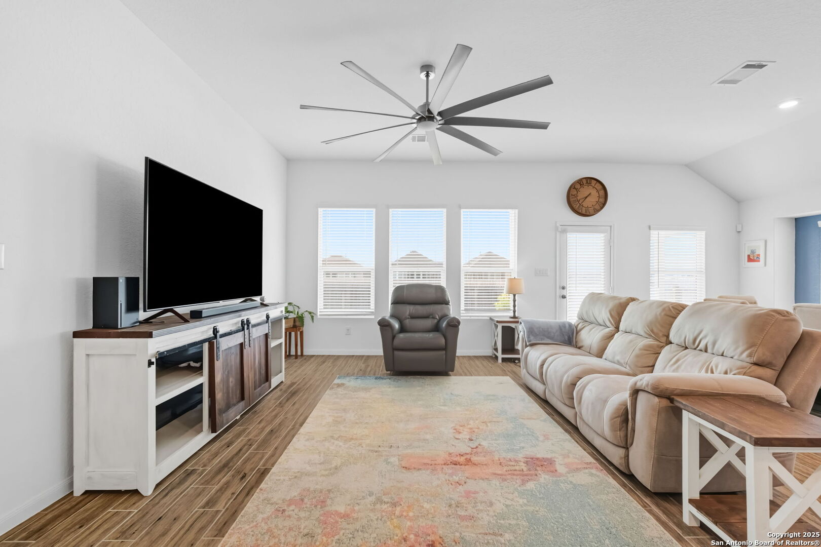 8950 Rancher Place Seguin, TX 78155 - Photo 10 of 34 a living room with furniture and a flat screen tv