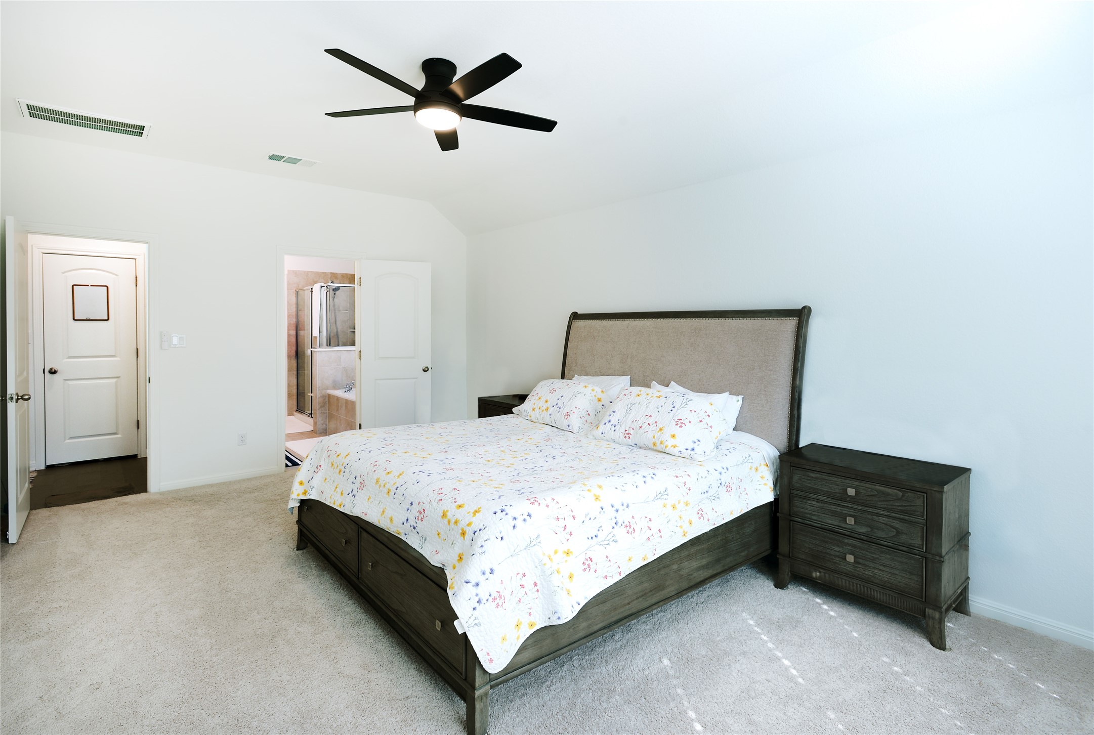 4586 Post Loop Round Rock, TX 78681 - Photo 18 of 29 View of primary bedroom looking into the ensuite bath and hallway