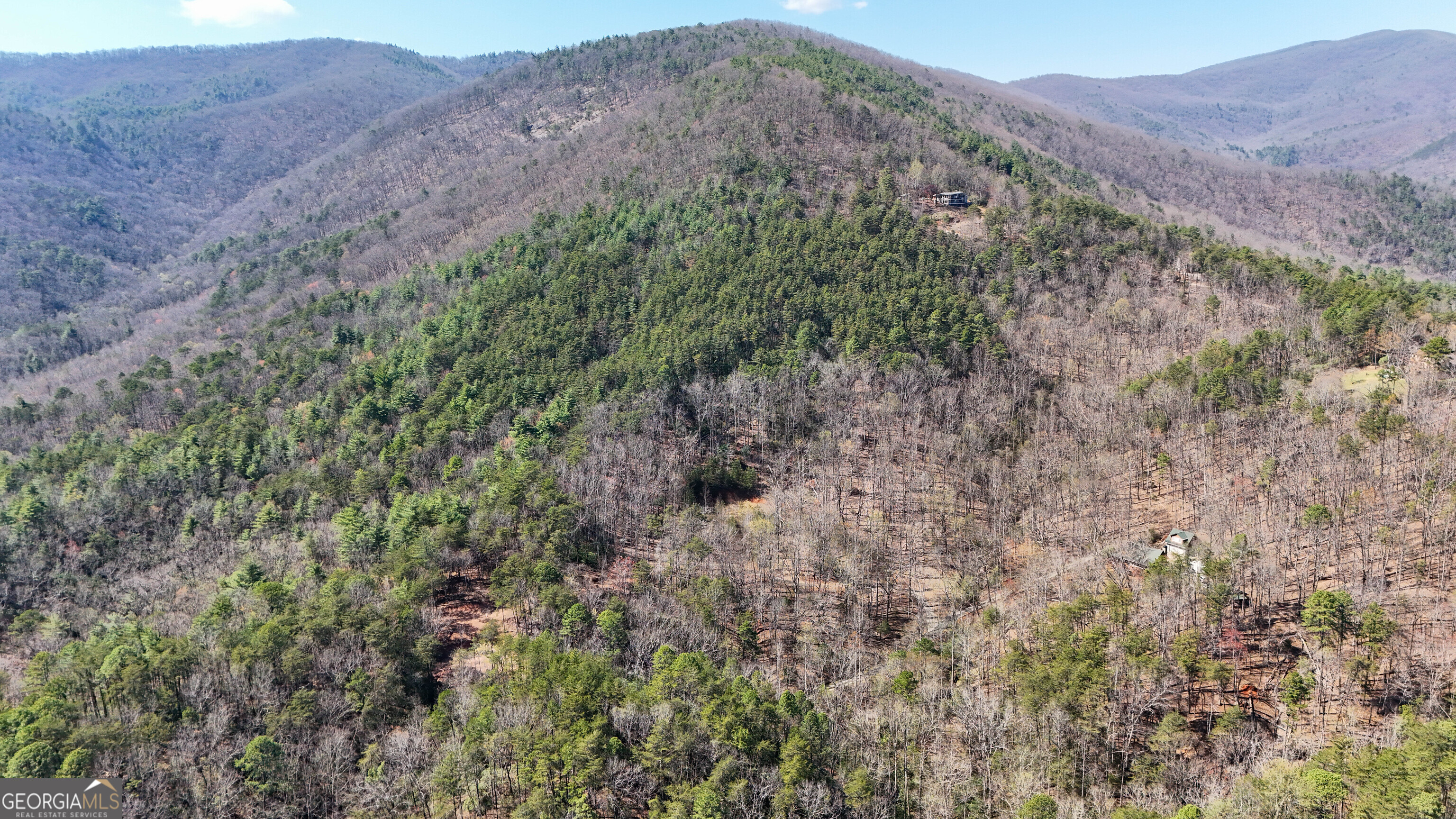 6 Chimney Mountain Road Sautee Nacoochee, GA 30571 - Photo 1 of 72 a view of a lush green hillside and a mountain