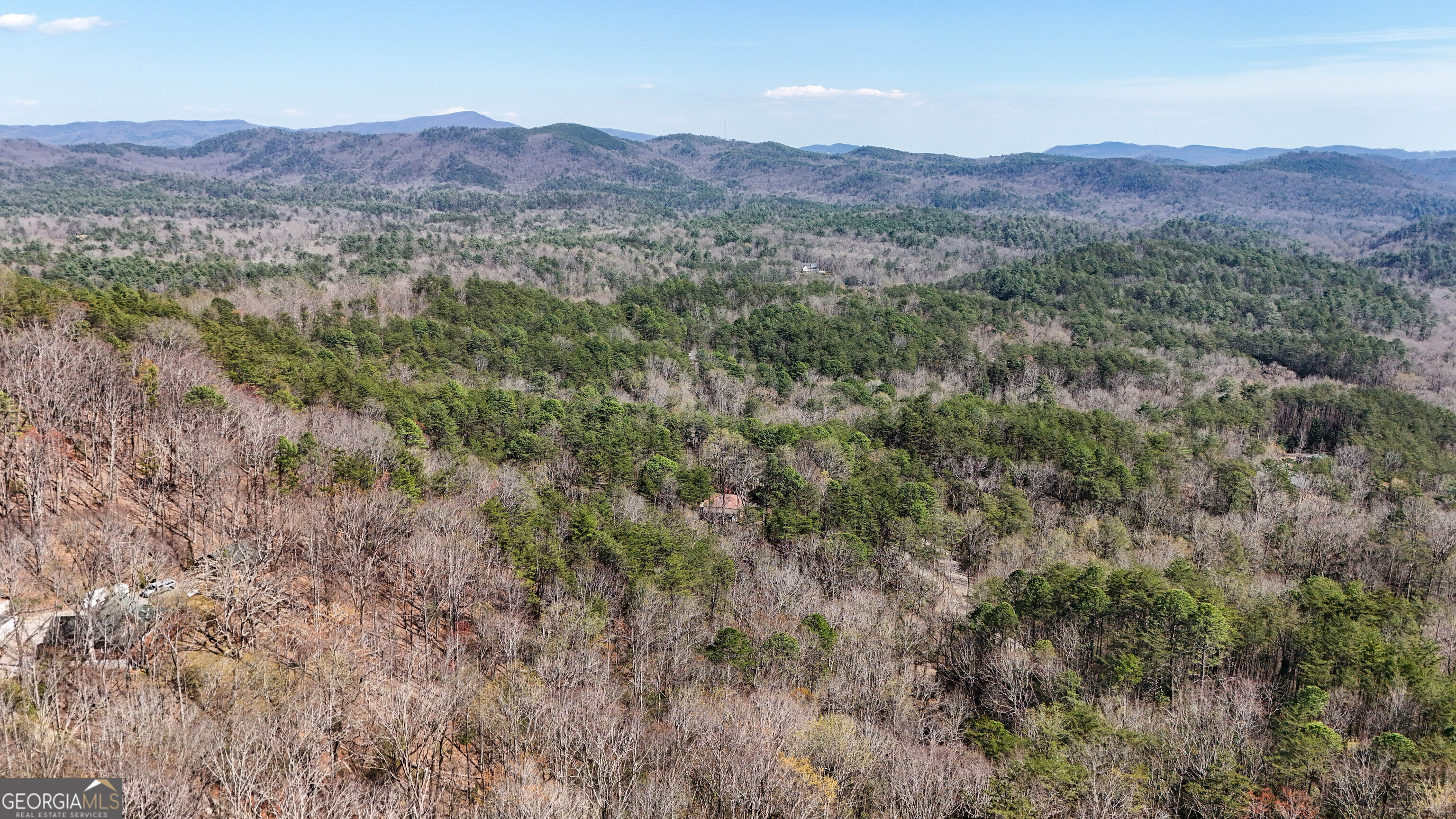 6 Chimney Mountain Road Sautee Nacoochee, GA 30571 - Photo 7 of 72 a view of a lush green hillside and a houses