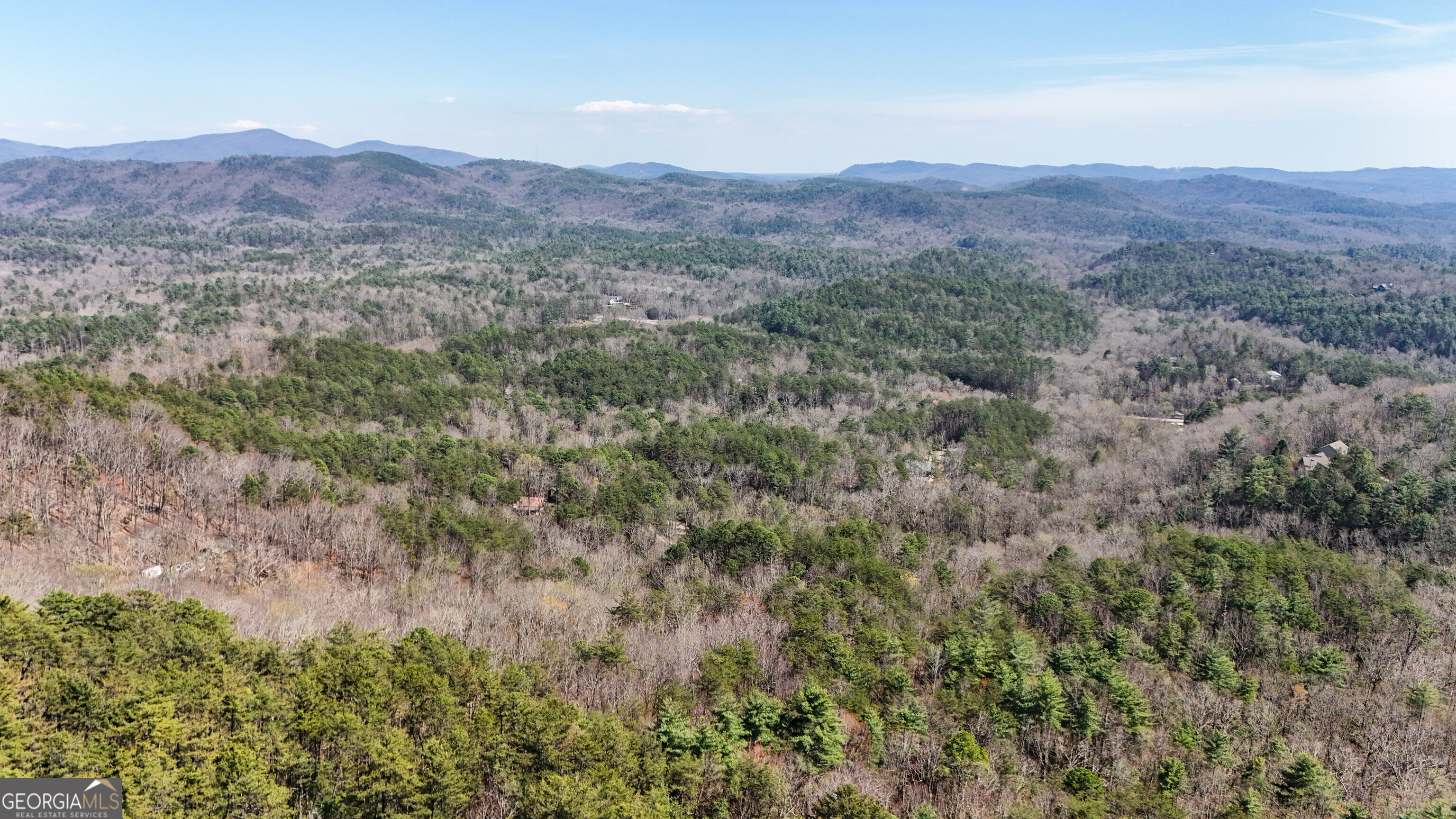6 Chimney Mountain Road Sautee Nacoochee, GA 30571 - Photo 9 of 72 a view of a lush green hillside and a houses
