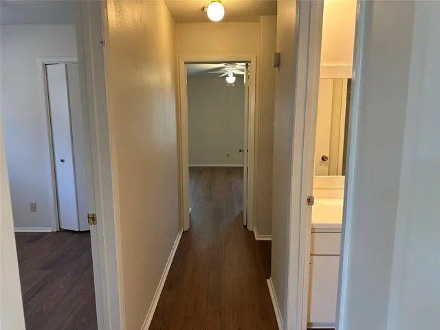 a view of a bathroom from the hallway