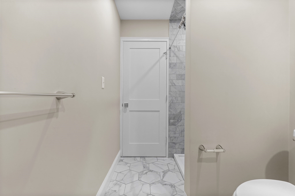 769 East 6th Street, Unit 1 Boston, MA 02127 - Photo 9 of 18 a bathroom with a glass door shower