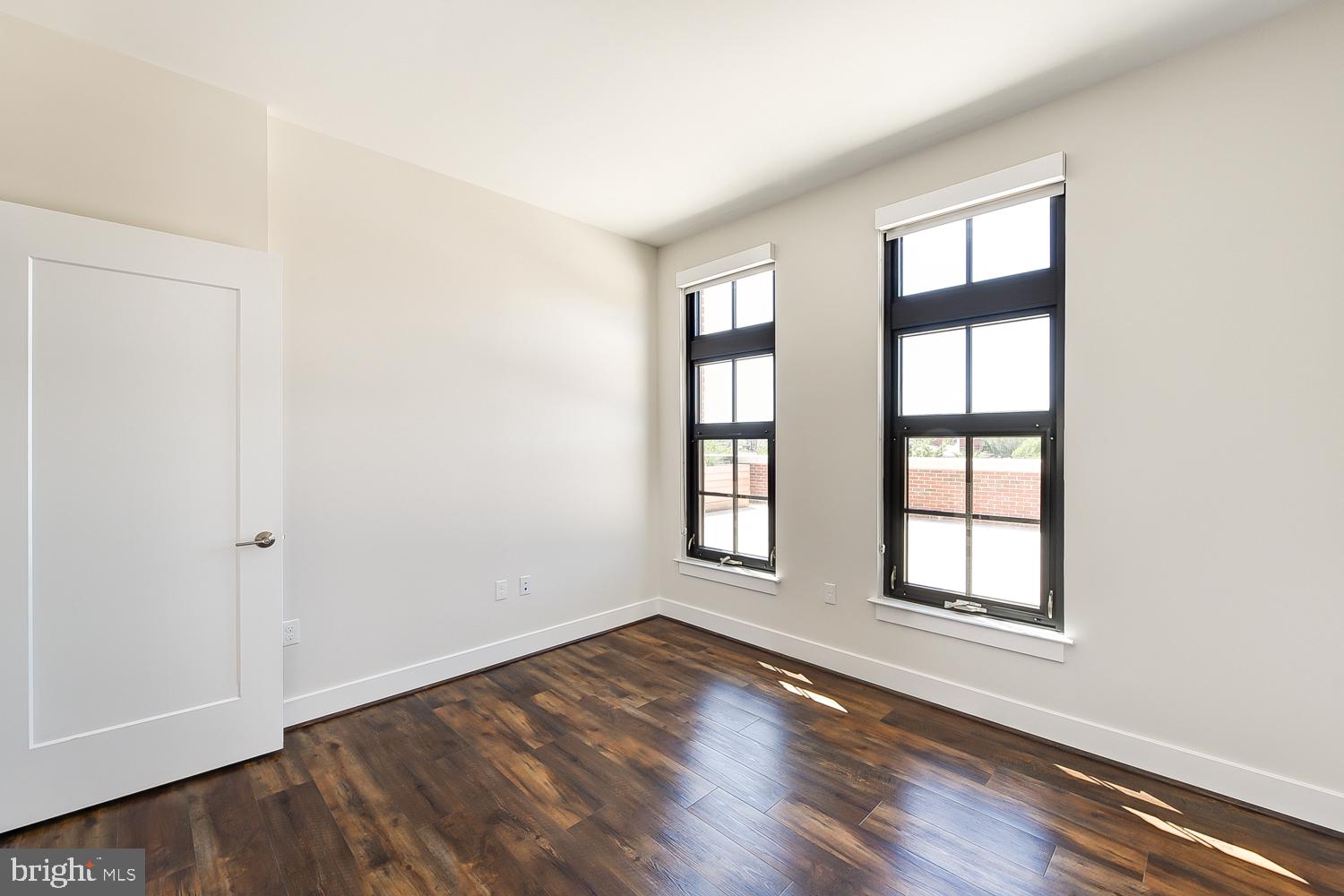 901 H Street Northeast, Unit 643 Washington, DC 20002 - Photo 11 of 82 an empty room with wooden floor and windows