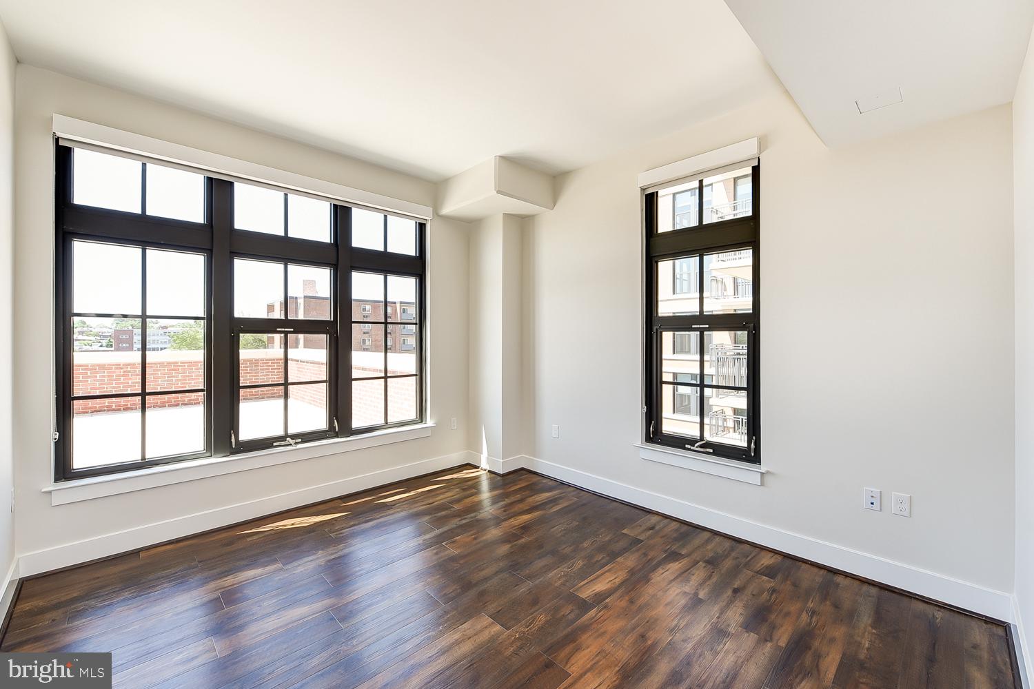 901 H Street Northeast, Unit 643 Washington, DC 20002 - Photo 16 of 82 a view of an empty room with a window and wooden floor