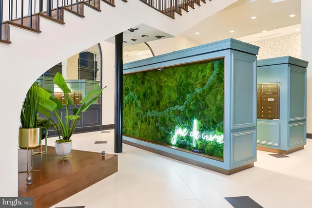 a view of swimming pool with outdoor seating and plants