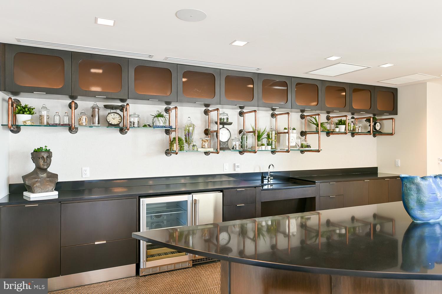 901 H Street Northeast, Unit 643 Washington, DC 20002 - Photo 65 of 82 a kitchen with stainless steel appliances granite countertop a stove and a refrigerator