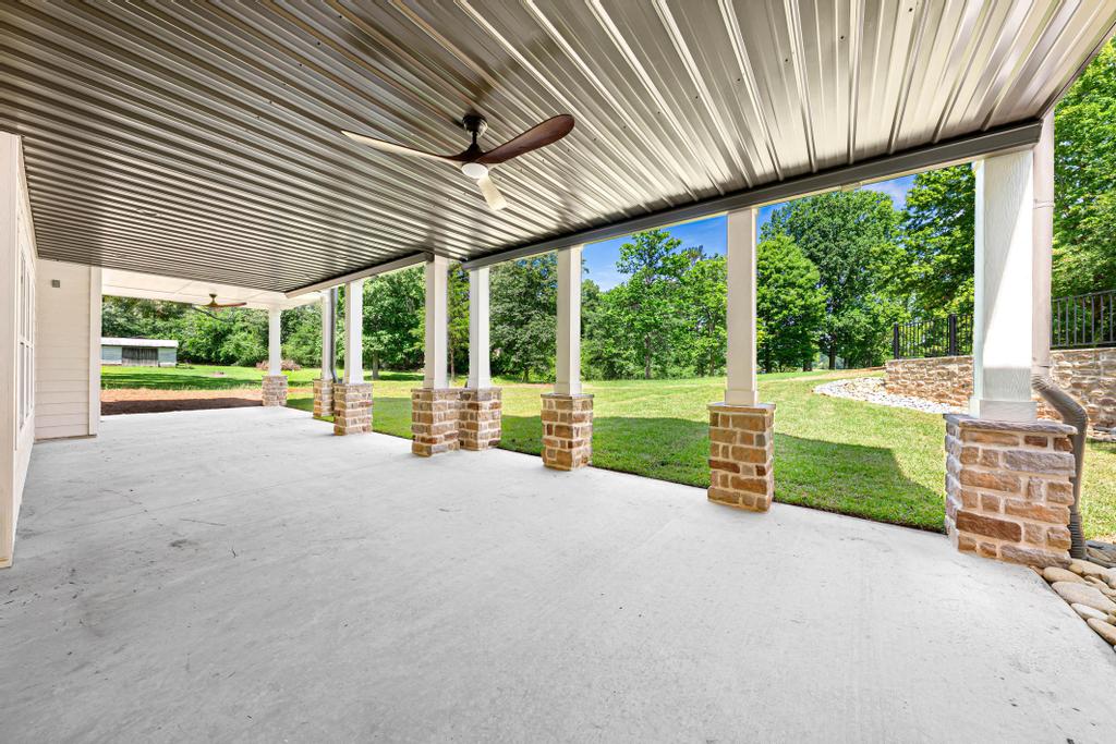 707 Vickery Street Extension Hartwell, GA 30643 - Photo 40 of 50 A spacious covered patio provides a delightful outdoor living area with verdant views.