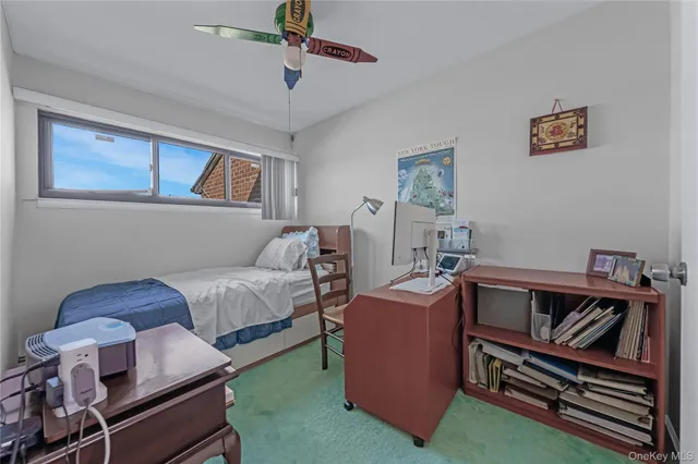 a white toilet sitting next to a shower