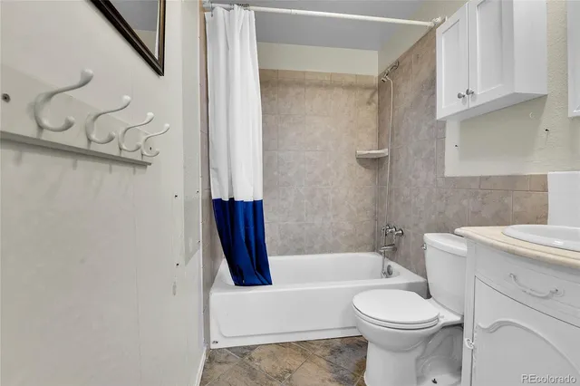 a bedroom with bed and tv