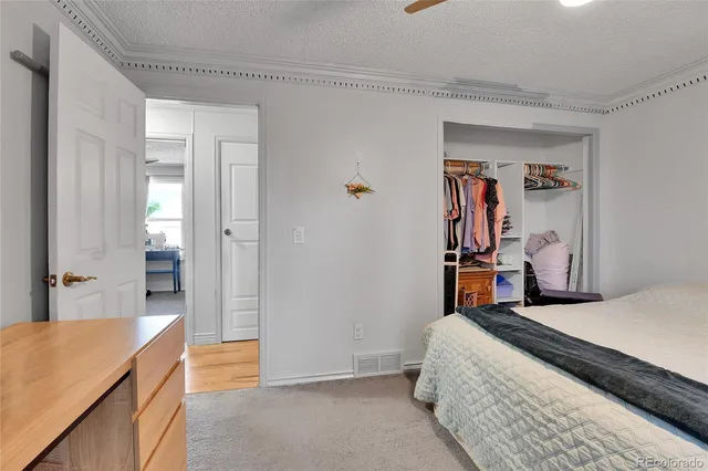 a room with a table chairs and a walk in closet