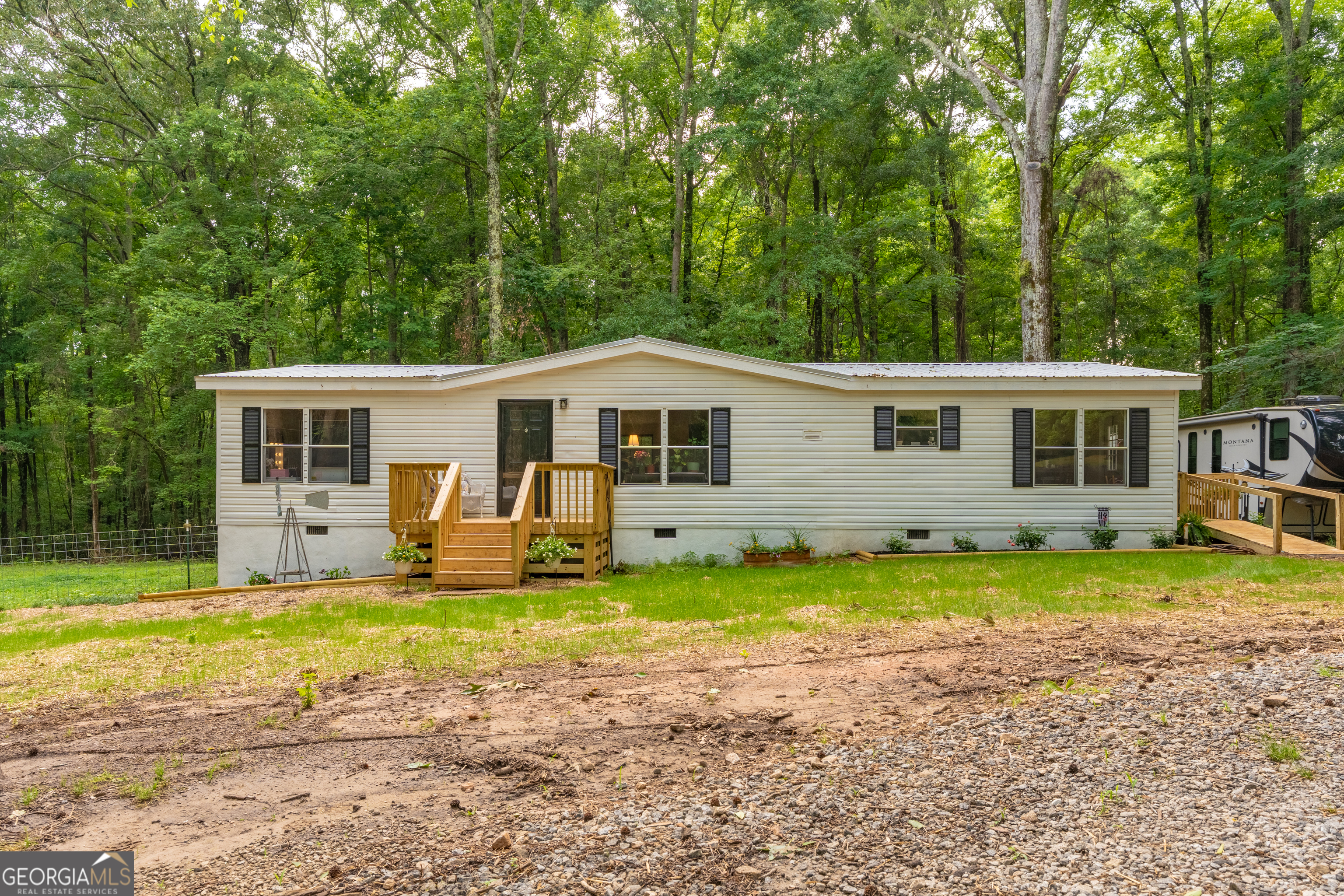 452 Aikenton Road Monticello, GA 31064 - Photo 42 of 47 a view of a house with a yard and sitting area