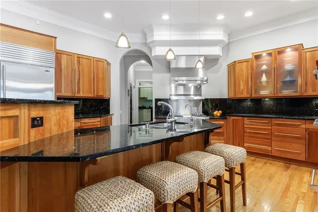 a kitchen with a stove and a refrigerator