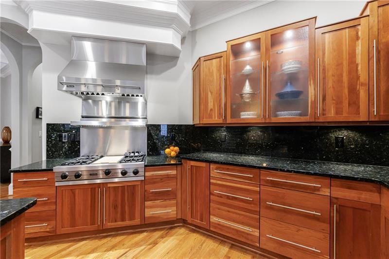 1255 Beech Haven Road Northeast Atlanta, GA 30324 - Photo 20 of 87 a kitchen with stainless steel appliances granite countertop a stove a sink and a microwave