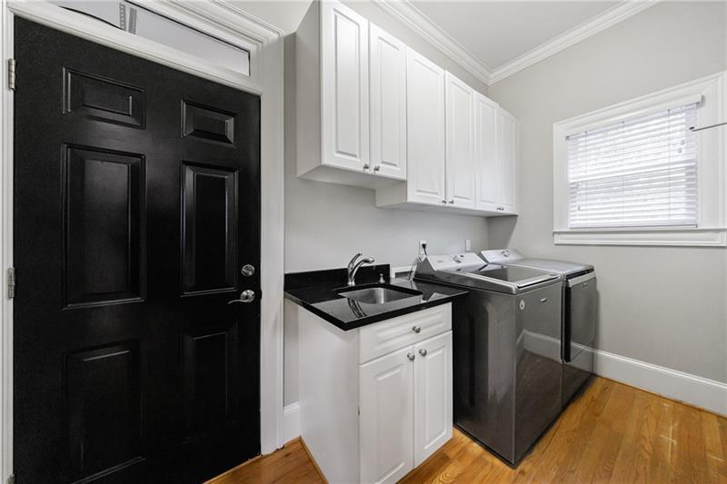 1255 Beech Haven Road Northeast Atlanta, GA 30324 - Photo 27 of 87 a kitchen with granite countertop a sink stove and cabinets