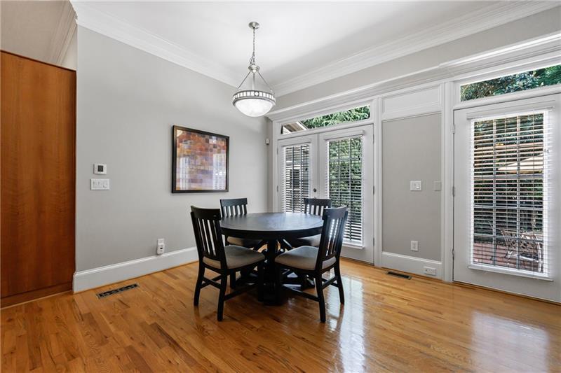 1255 Beech Haven Road Northeast Atlanta, GA 30324 - Photo 29 of 87 a view of a dining room with furniture window and wooden floor