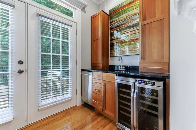 a spacious bedroom with a bed and a flat screen tv