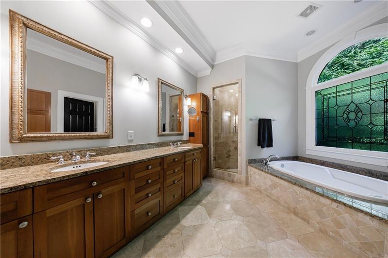 1255 Beech Haven Road Northeast Atlanta, GA 30324 - Photo 36 of 87 a spacious bathroom with a double vanity sink and a large mirror