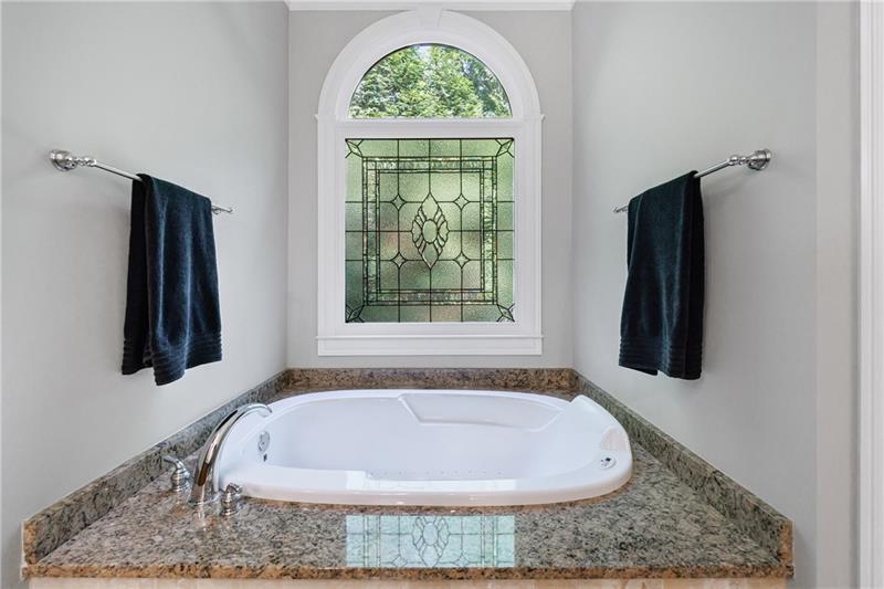 1255 Beech Haven Road Northeast Atlanta, GA 30324 - Photo 39 of 87 a bath tub sitting in a bathroom next to a window