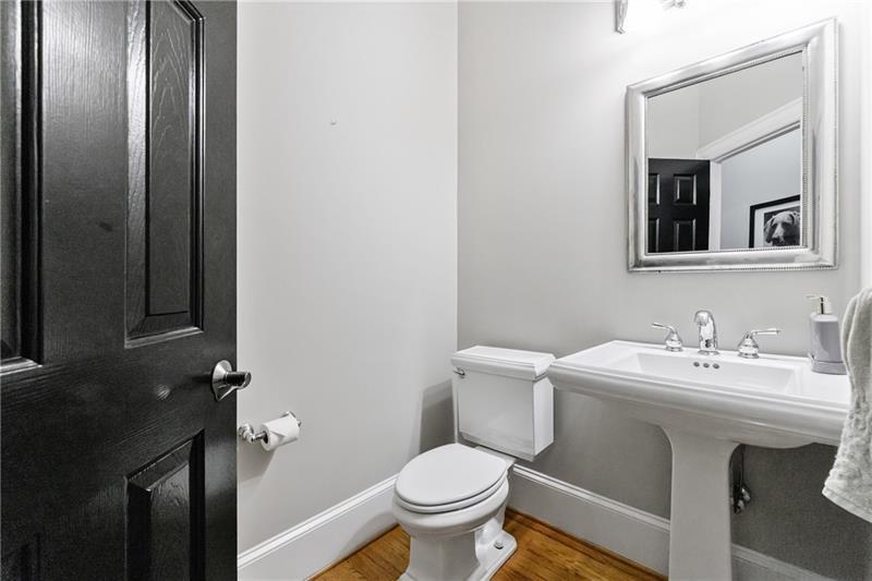 1255 Beech Haven Road Northeast Atlanta, GA 30324 - Photo 46 of 87 a bathroom with a toilet sink and mirror