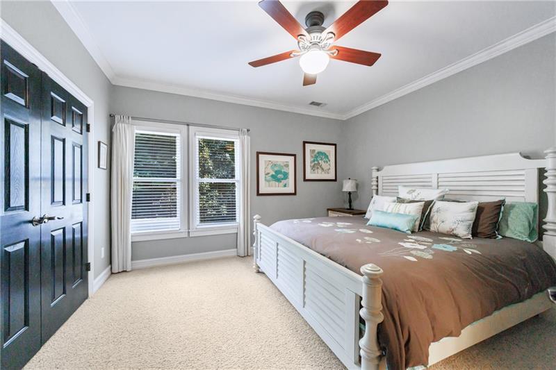 1255 Beech Haven Road Northeast Atlanta, GA 30324 - Photo 50 of 87 a bedroom with a large bed and a chandelier