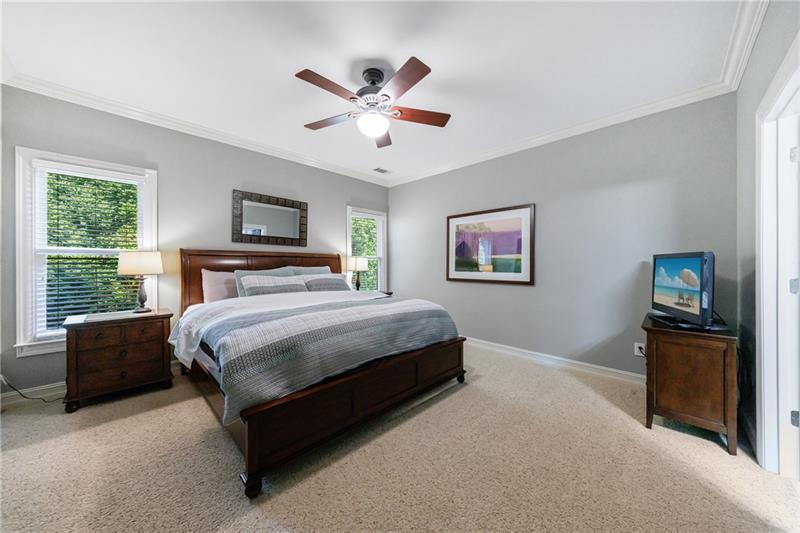 1255 Beech Haven Road Northeast Atlanta, GA 30324 - Photo 52 of 87 a spacious bedroom with a bed and a flat screen tv