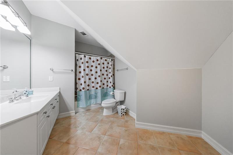 1255 Beech Haven Road Northeast Atlanta, GA 30324 - Photo 55 of 87 a bathroom with a sink mirror and toilet