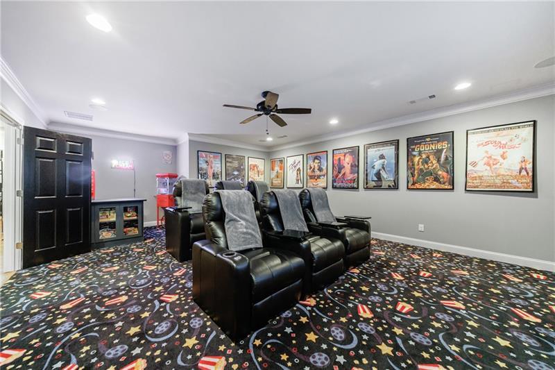 1255 Beech Haven Road Northeast Atlanta, GA 30324 - Photo 61 of 87 a living room with furniture a projector and a flat screen tv