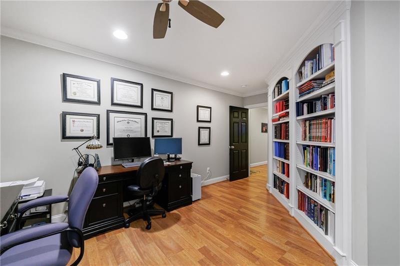 1255 Beech Haven Road Northeast Atlanta, GA 30324 - Photo 64 of 87 a view of a workspace with furniture and a bookshelf